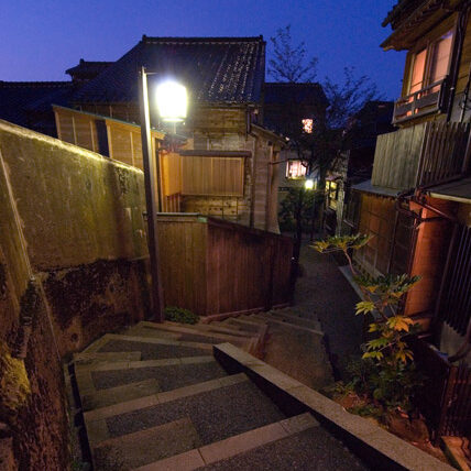 the dark slope into a tea house district